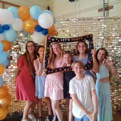 Children and their teacher at a disco