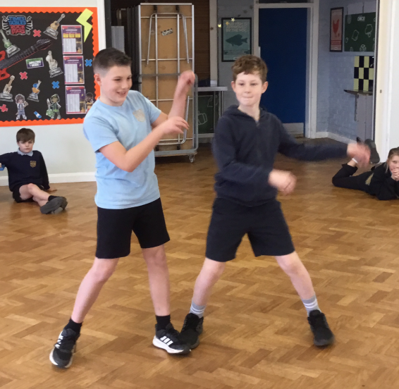 2 boys dancing to Thriller