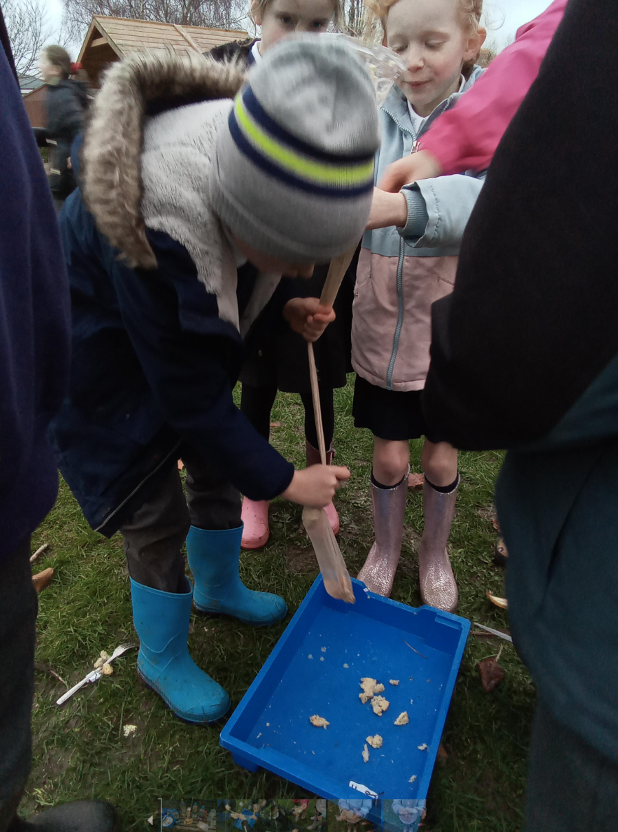 Child mashing biscuits