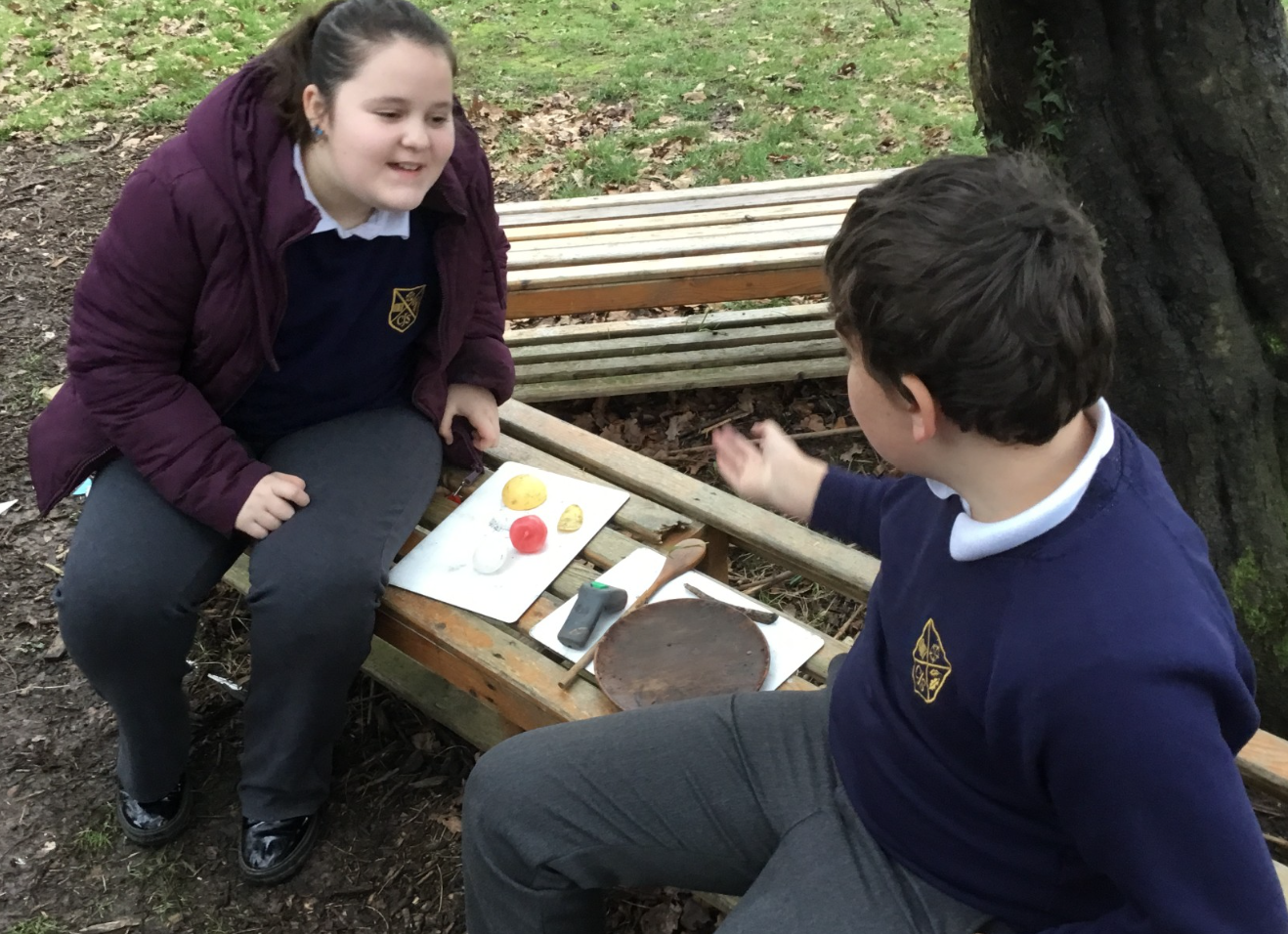Children talking on bench