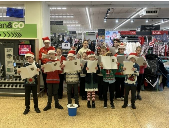 Children singng at ASDA