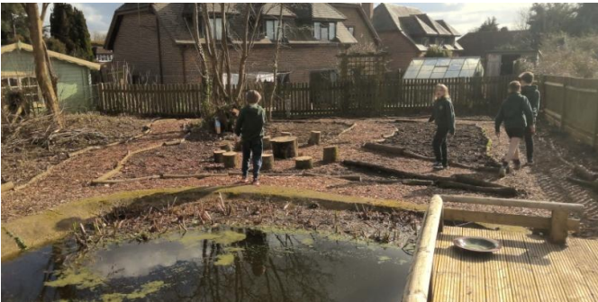 children in a pond area