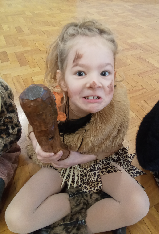 Girl pretending to be stone age person