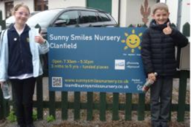 2 children outside sunny smiles