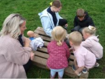 Toddlers playing with older pupils