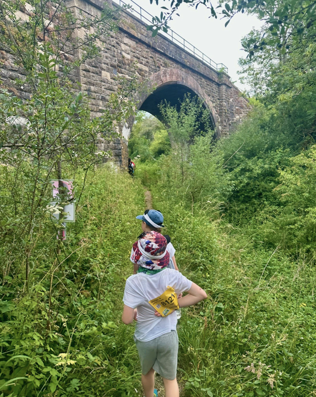 children walking through foliage