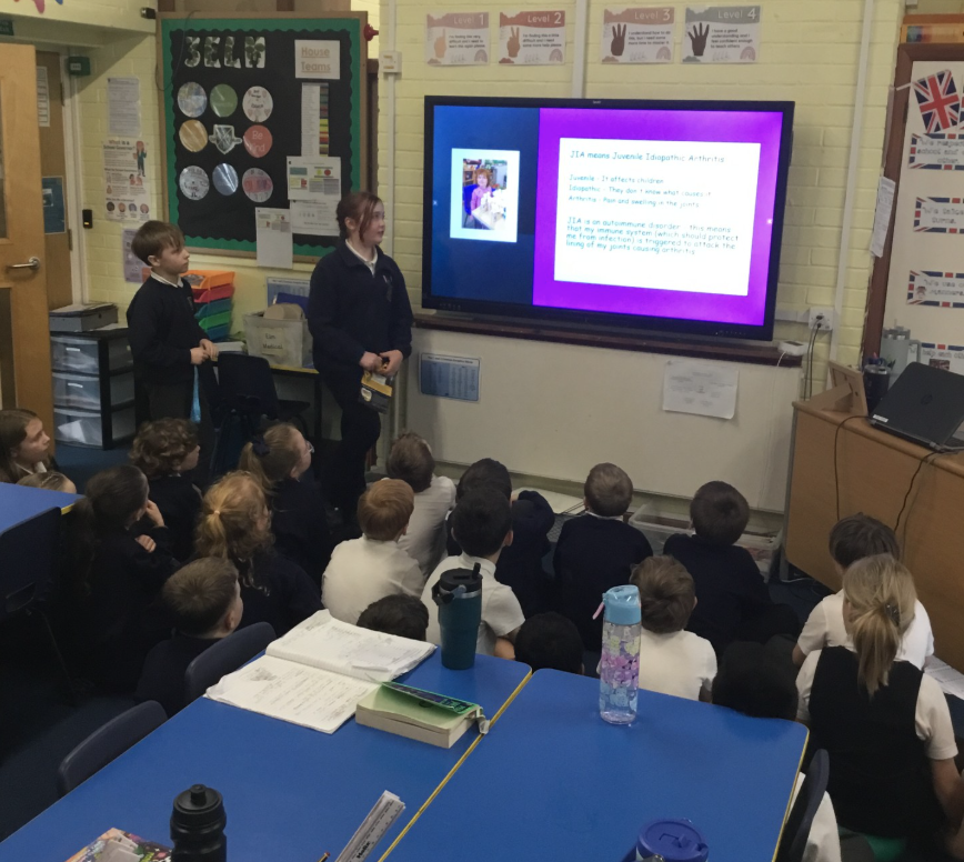 2 children presenting to a class