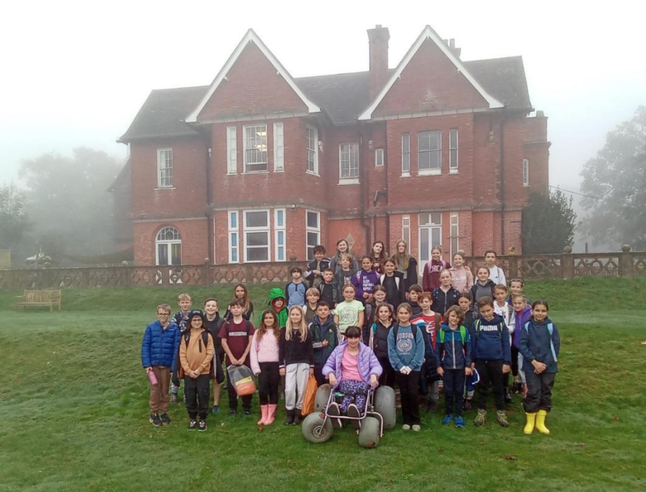 Group of children outside a house