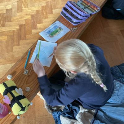 Child drawing seahorse habitat