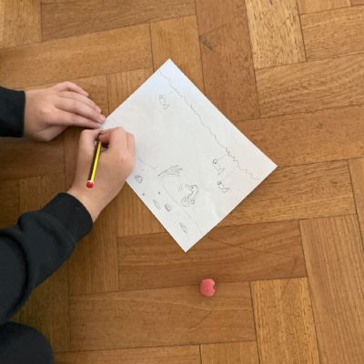 Child drawing seahorse habitat