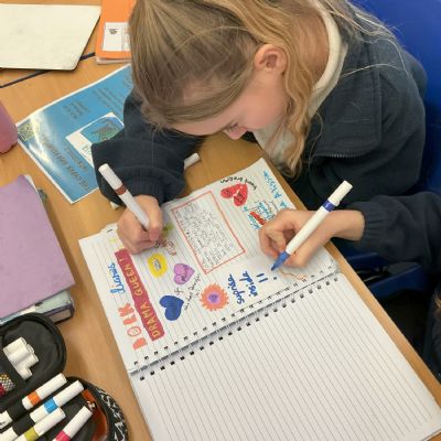 Children working on their reading scrapbook