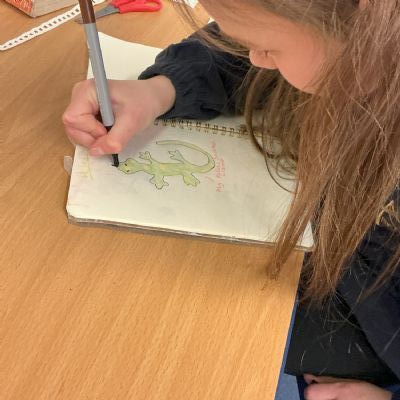 Children working on their reading scrapbook