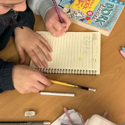 Children working on their reading scrapbook