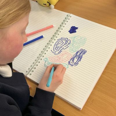 Children working on their reading scrapbook