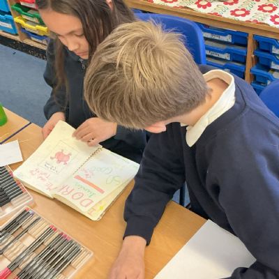 Children working on their reading scrapbook