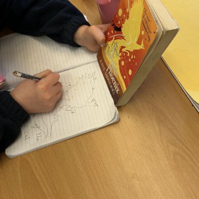 Children working on their reading scrapbook